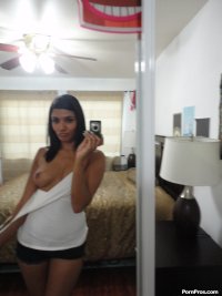 Brunette Arab babe Shazia Sahari takes sexy selfies in front of the mirror