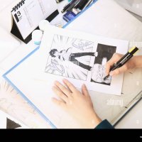 Japanese Manga artist working in the studio Stock Photo