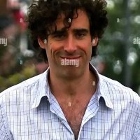 Comedy actor Stephen Mangan walking with a shopping bag in North London London England