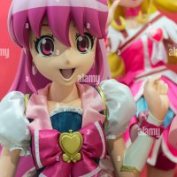 A large 3D model of a colourful Japanese anime girl character in a display of manga style art Stock Photo